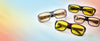 Four NOIR Edge glasses with yellow and light amber filter lenses in grey, black and tortoiseshell frames